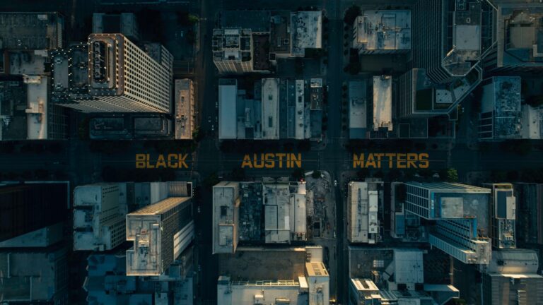 white and brown concrete buildings during night time